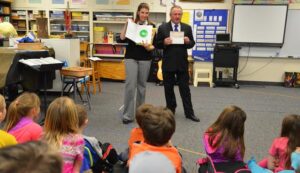 Shepherd Elementary School music teacher Dawn Sherseth accepts a grant from the Montana Masonic Foundation delivered by Lewie Fletcher, a member of Huntley Project Masonic Lodge 144. (Jonathan McNiven photo)