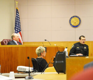 Kevin Evans, undersheriff of the Yellowstone County Sheriff’s department, testifies about officer training on Tuesday during the coroner’s inquest into the shooting death of 28-year-old Loren Simpson. At left is Park County Coroner Al Jenkins, who presided over the inquest. (Judy Killen photo