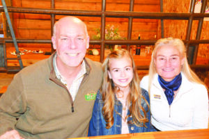 Kamrey Leiser enjoyed a chat with Greg Gianforte and his wife Susan, who bought a painting at the live auction. (Judy Killen photo)