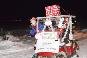 Andrea Drinkwalter and Rebecca Meredith driving their Gloss Studio Golf Cart at the Pryor Creek Clubhouse at the 1st Annual Golf Cart Pa-Looza. Photo by Jonathan McNiven-Yellowstone County News.