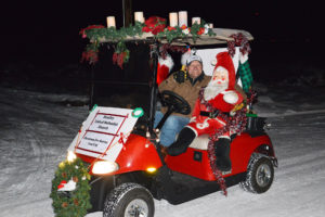 Justin Logan drives the Huntley United Methodist Church cart in the Golf Cart Pa-Looza parade in Huntley. (Jonathan McNiven photo-Yellowstone County News)