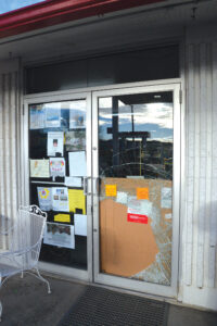 The glass entrance door to the station was shattered by a large rock to gain entry in the early morning of Saturday, Dec 22. (photo by Elisa Schlosser)